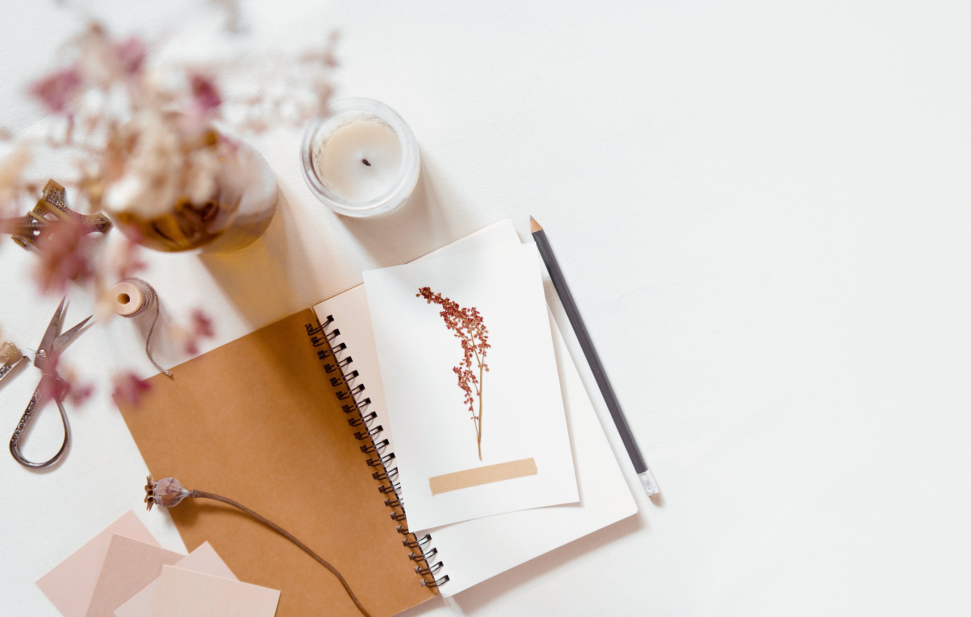 Brown and beige flatlay with pressed flowers, neutral aesthetic background, november cottagecore